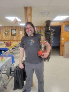 lodge member holding the chili trophy