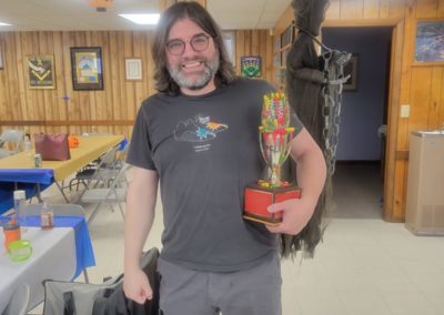lodge member holding the chili trophy