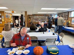dining area with members enjoying chili