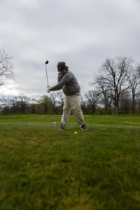 Man swinging the golf club