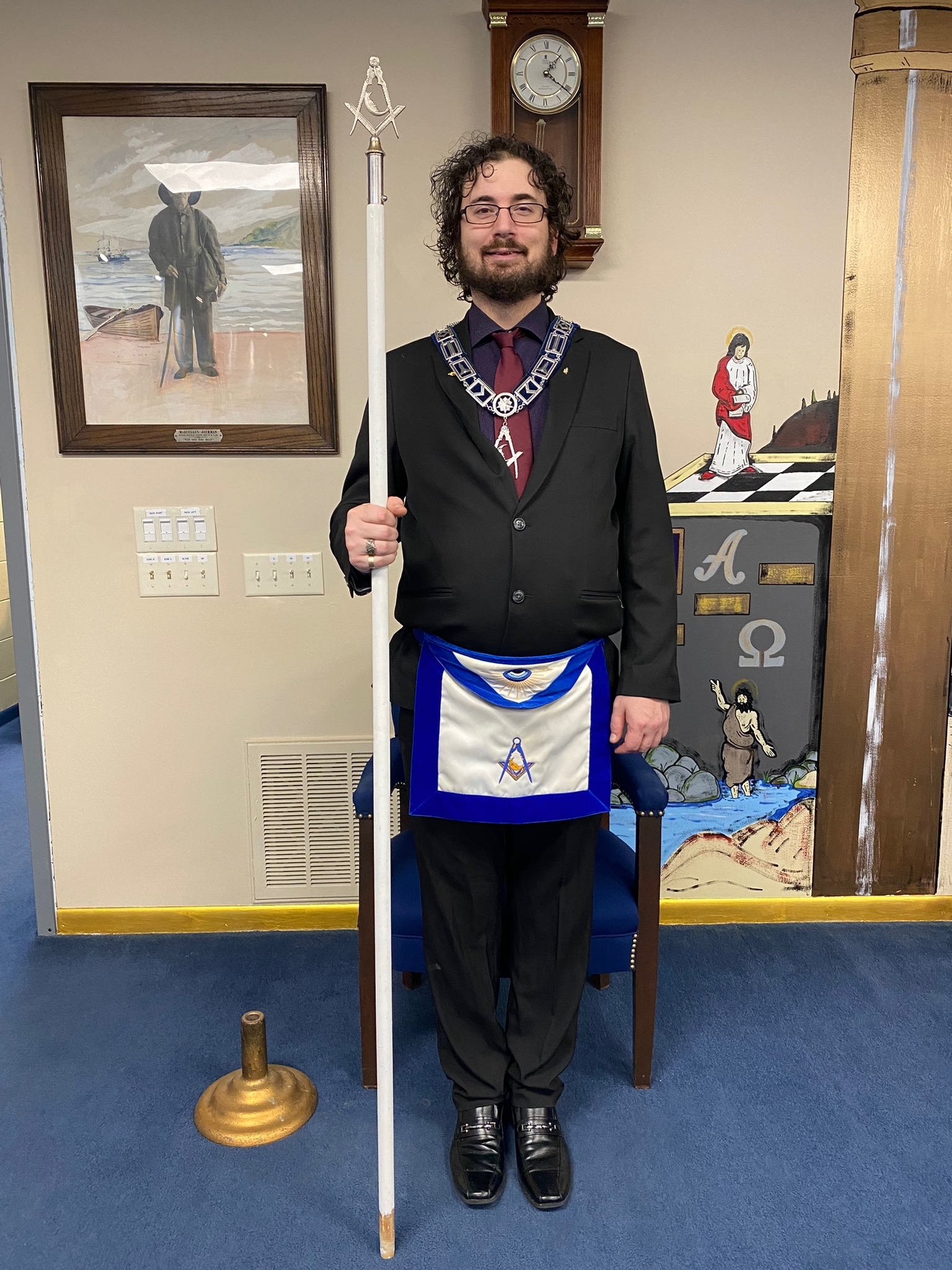 Junior Deacon of Broad Ripple Lodge holding his staff