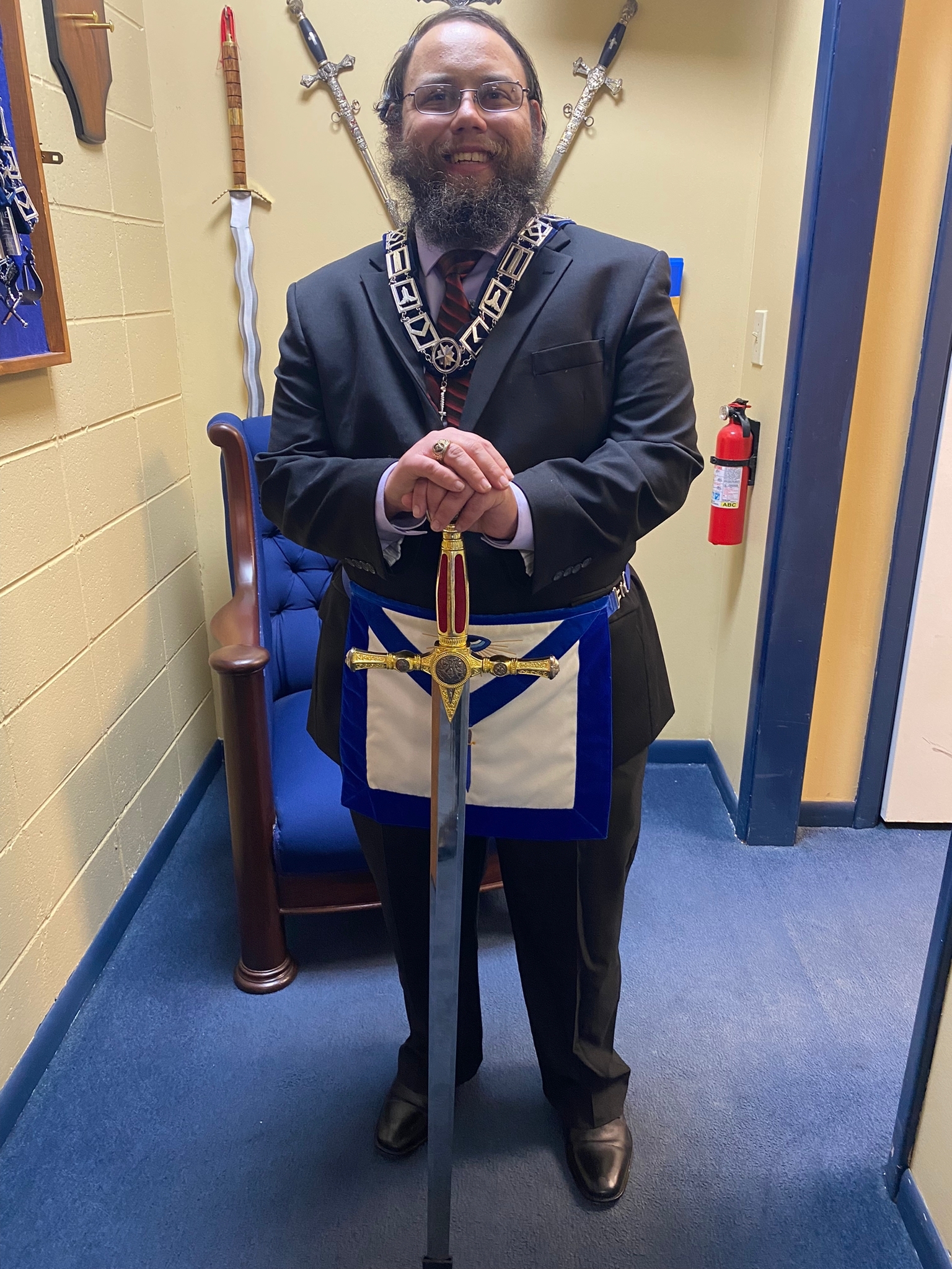 Tyler of Broad Ripple Lodge holding his sword
