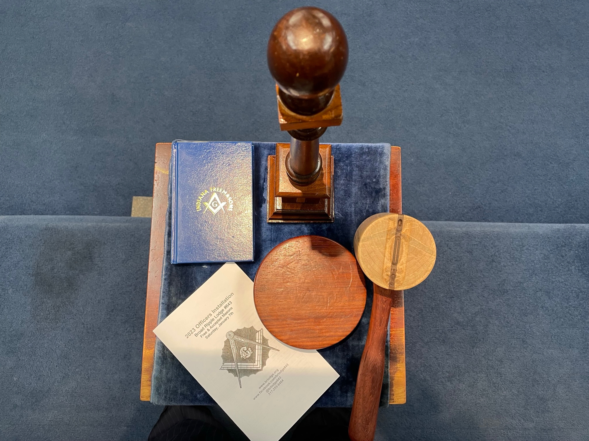 Junior Warden's station with gavel, strike plate, column, ritual book, and installation program